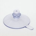 Ventosa Ø 50 mm, trasparente, con linguetta di rilascio – bottone Ø 15,5 mm, collo Ø 12 mm, foro Ø 3 mm + perno di fissaggio